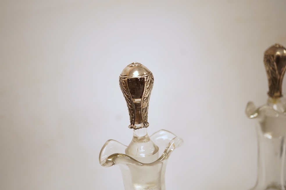 A pair of Hanau silver mounted moulded glass decanters and stoppers, by Berthold Muller, import marks for Glasgow, 1900/1901, 24cm, a.f.